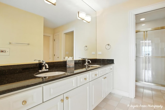 32756 N Stone Manor Dr, Grayslake, IL 60030 - bathroom featuring double vanity, tile patterned flooring, and a shower with shower door