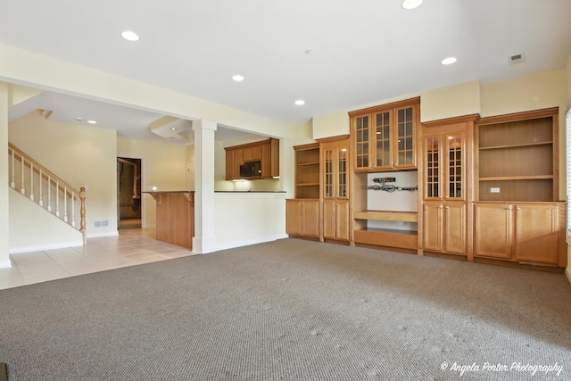 32756 N Stone Manor Dr, Grayslake, IL 60030 - unfurnished living room with light carpet, recessed lighting, stairs, and ornate columns