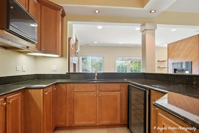 32756 N Stone Manor Dr, Grayslake, IL 60030 - kitchen featuring beverage cooler, black microwave, brown cabinetry, dark stone counters, and recessed lighting
