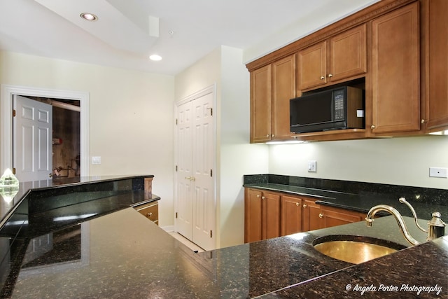 32756 N Stone Manor Dr, Grayslake, IL 60030 - kitchen featuring black microwave, dark stone counters, brown cabinetry, and recessed lighting