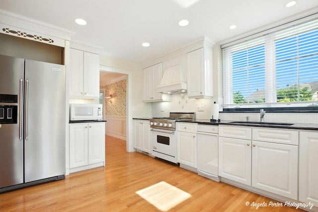 32756 N Stone Manor Dr, Grayslake, IL 60030 - kitchen with premium appliances, custom exhaust hood, dark countertops, white cabinets, and wainscoting
