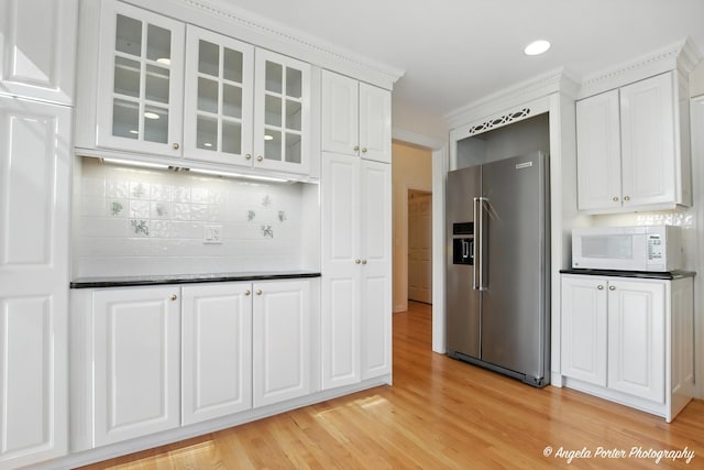 32756 N Stone Manor Dr, Grayslake, IL 60030 - kitchen with high quality fridge, white microwave, glass insert cabinets, white cabinets, and light wood-style floors