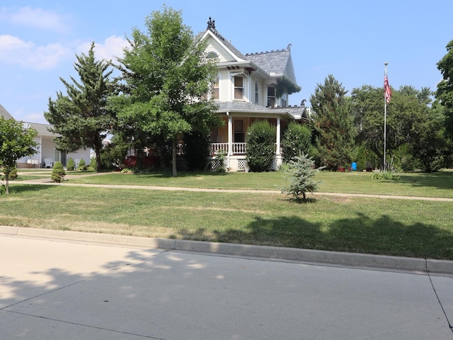 303 N Walnut St, Wenona, IL 61377 - view of front of property featuring a porch and a front lawn