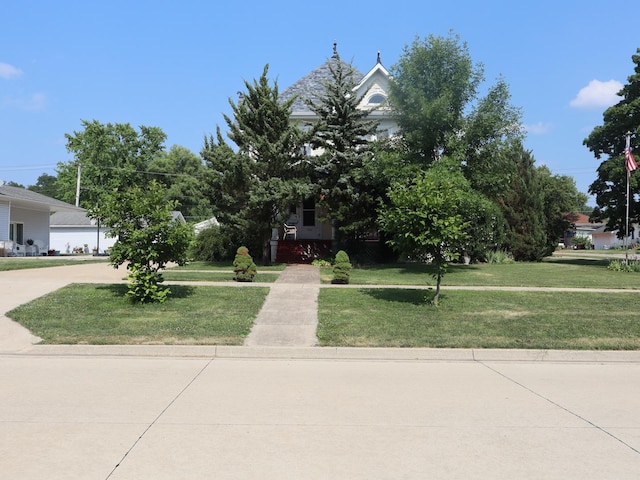 303 N Walnut St, Wenona, IL 61377 - view of property hidden behind natural elements featuring a front yard