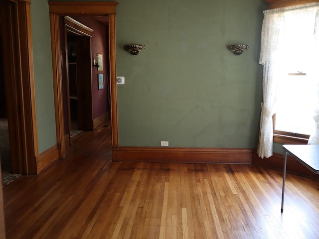 303 N Walnut St, Wenona, IL 61377 - empty room with hardwood / wood-style flooring and baseboards