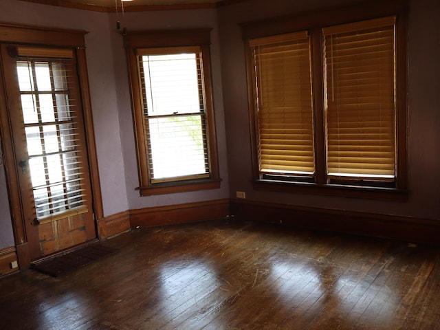 303 N Walnut St, Wenona, IL 61377 - empty room featuring dark wood finished floors and baseboards