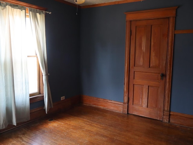 303 N Walnut St, Wenona, IL 61377 - empty room with wood-type flooring and baseboards