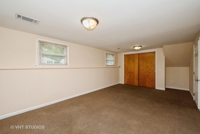 401 Elden Dr, Cary, IL 60013 - unfurnished bedroom featuring carpet, a closet, and multiple windows