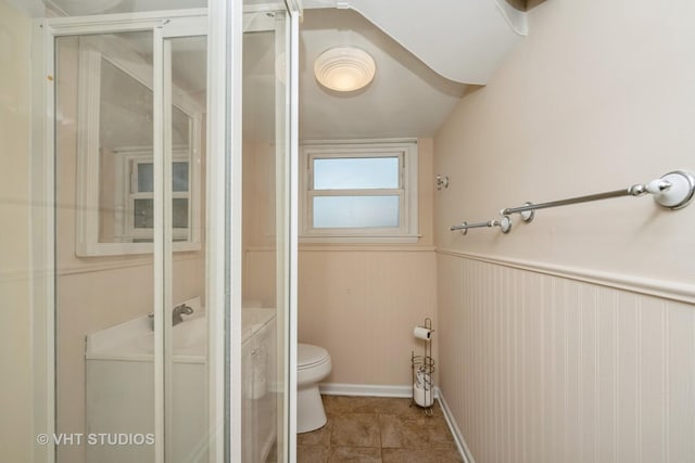 401 Elden Dr, Cary, IL 60013 - bathroom with a stall shower, tile patterned flooring, and wainscoting