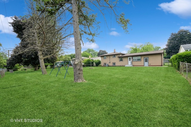 401 Elden Dr, Cary, IL 60013 - fenced backyard featuring a playground