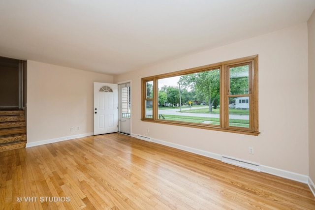 401 Elden Dr, Cary, IL 60013 - unfurnished living room featuring light wood finished floors and baseboards
