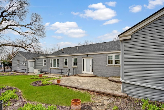 2425 Flossmoor Rd, Flossmoor, IL 60422 - back of property featuring a patio area, a lawn, and roof with shingles