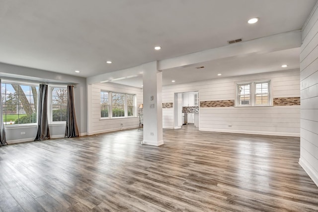 2425 Flossmoor Rd, Flossmoor, IL 60422 - unfurnished living room with plenty of natural light, wood finished floors, recessed lighting, and wood walls