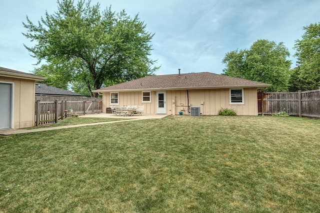 3536 Buck Ave, Joliet, IL 60431 - back of property with a fenced backyard, board and batten siding, and a patio area