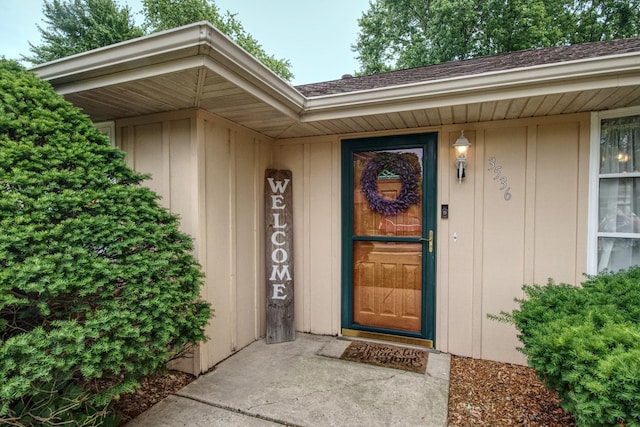 3536 Buck Ave, Joliet, IL 60431 - doorway to property with board and batten siding and roof with shingles