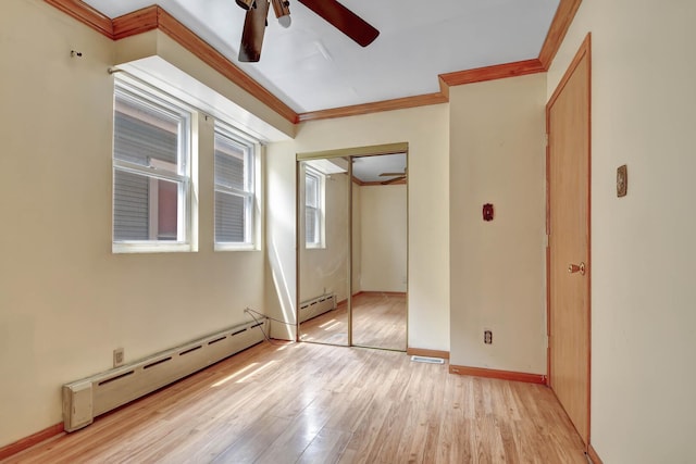 6238 S Kolmar Ave, Chicago, IL 60629 - unfurnished bedroom featuring a baseboard heating unit, crown molding, light wood-type flooring, a closet, and ceiling fan