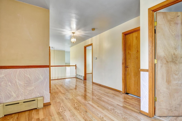 6238 S Kolmar Ave, Chicago, IL 60629 - unfurnished room featuring a baseboard radiator and wood finished floors