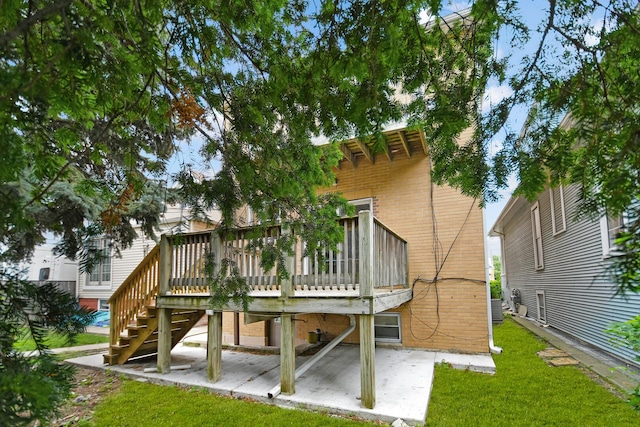 6238 S Kolmar Ave, Chicago, IL 60629 - rear view of property featuring brick siding, a yard, a deck, stairway, and a patio