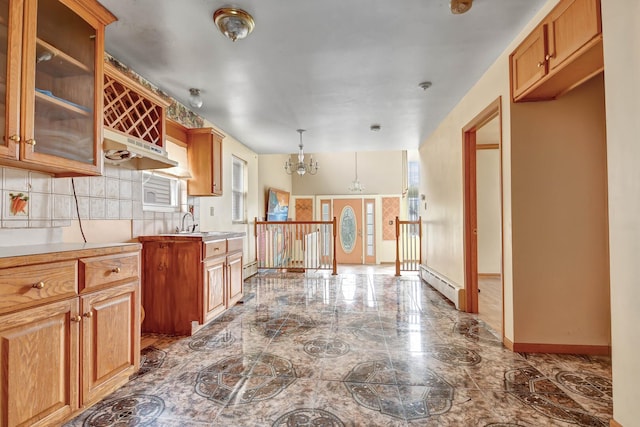 6238 S Kolmar Ave, Chicago, IL 60629 - kitchen with marble tiled floors, baseboard heating, a chandelier, light countertops, and glass insert cabinets