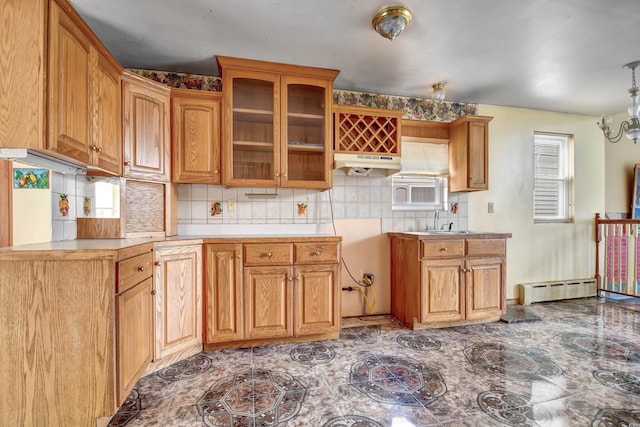 6238 S Kolmar Ave, Chicago, IL 60629 - kitchen with under cabinet range hood, a baseboard heating unit, tasteful backsplash, glass insert cabinets, and brown cabinets