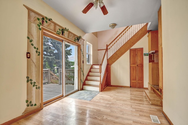 6238 S Kolmar Ave, Chicago, IL 60629 - foyer entrance featuring light wood-type flooring, stairway, and a ceiling fan