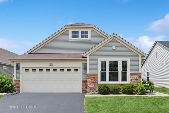 4015 Chesapeake Ln, Naperville, IL 60564 - view of front facade with stone siding, asphalt driveway, and a garage