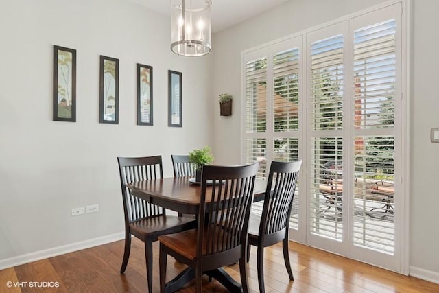 4015 Chesapeake Ln, Naperville, IL 60564 - dining space featuring wood finished floors and a chandelier