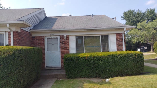 400 Salem Sq Unit 000, Bolingbrook, IL 60440 - view of exterior entry with brick siding and roof with shingles