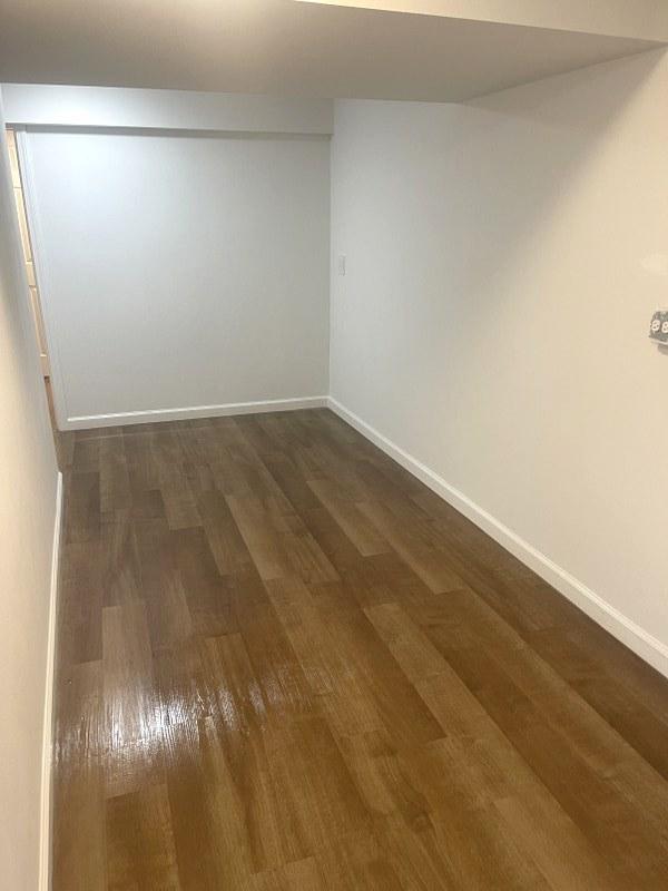 400 Salem Sq Unit 000, Bolingbrook, IL 60440 - spare room featuring dark wood-type flooring and baseboards