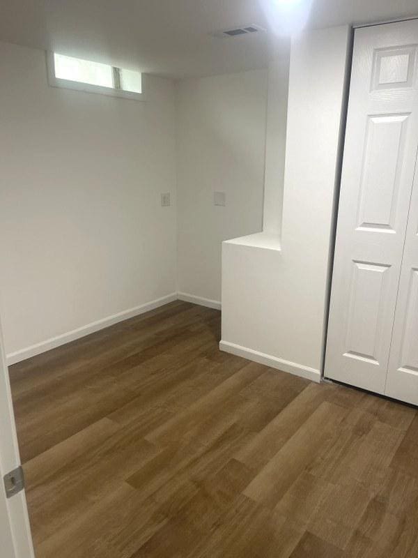 400 Salem Sq Unit 000, Bolingbrook, IL 60440 - basement featuring wood finished floors and baseboards