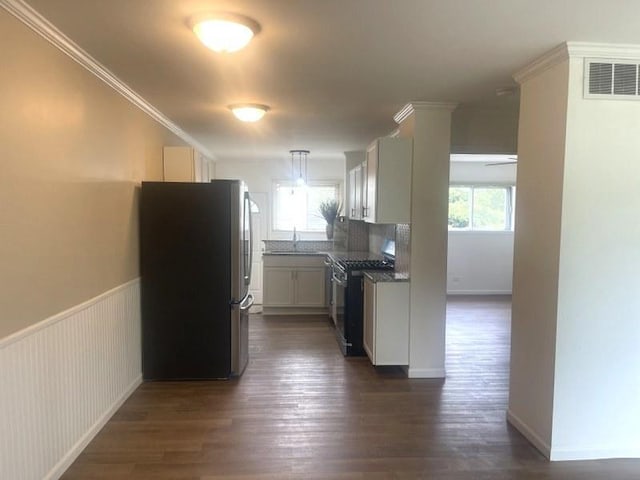 400 Salem Sq Unit 000, Bolingbrook, IL 60440 - kitchen featuring stainless steel appliances, dark wood-style flooring, decorative backsplash, dark countertops, and ornamental molding