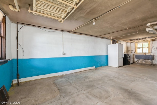 2721 W Prindiville St, Chicago, IL 60647 - basement featuring washer and clothes dryer and freestanding refrigerator