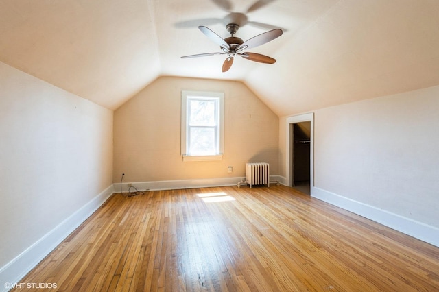 2721 W Prindiville St, Chicago, IL 60647 - bonus room with radiator, light wood-type flooring, lofted ceiling, and a ceiling fan