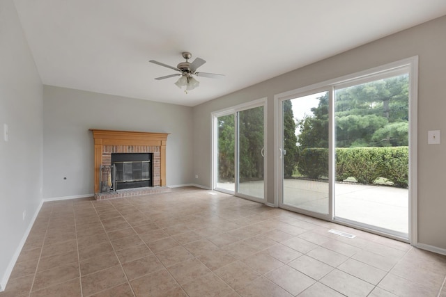395 Wildberry Ln, Bartlett, IL 60103 - unfurnished living room featuring ceiling fan, light tile patterned flooring, and a fireplace