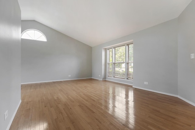 395 Wildberry Ln, Bartlett, IL 60103 - unfurnished room featuring vaulted ceiling and hardwood / wood-style flooring