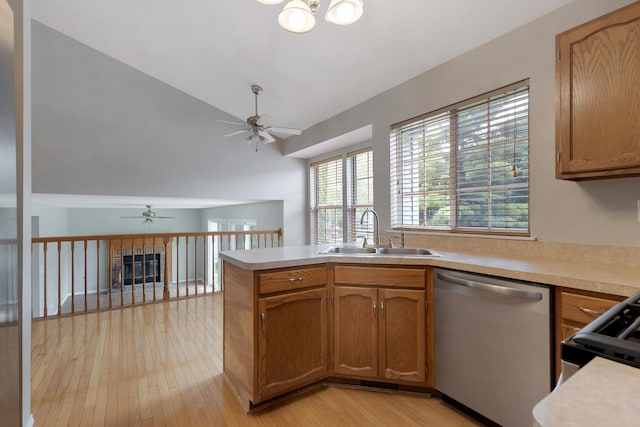 395 Wildberry Ln, Bartlett, IL 60103 - kitchen with dishwasher, a ceiling fan, light countertops, light wood-style floors, and high vaulted ceiling