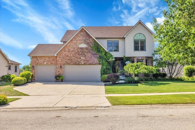 531 Danbury Dr, Oswego, IL 60543 - view of front of house with driveway, a front lawn, an attached garage, brick siding, and roof with shingles