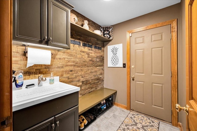 531 Danbury Dr, Oswego, IL 60543 - mudroom with a sink and light tile patterned floors