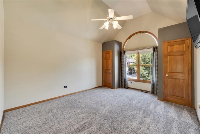 531 Danbury Dr, Oswego, IL 60543 - unfurnished bedroom with vaulted ceiling, light colored carpet, and a ceiling fan