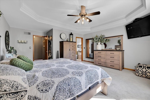 531 Danbury Dr, Oswego, IL 60543 - bedroom featuring a tray ceiling, light colored carpet, ornamental molding, and a ceiling fan