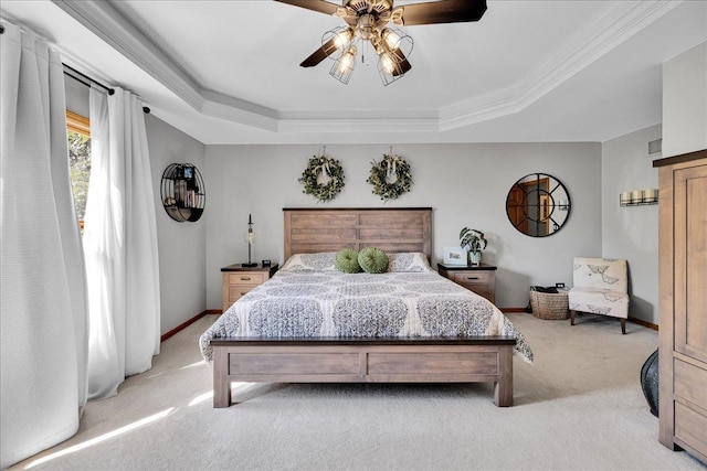 531 Danbury Dr, Oswego, IL 60543 - bedroom featuring light carpet, a tray ceiling, a ceiling fan, and ornamental molding