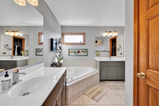 531 Danbury Dr, Oswego, IL 60543 - bathroom featuring tile patterned flooring, two vanities, and a garden tub