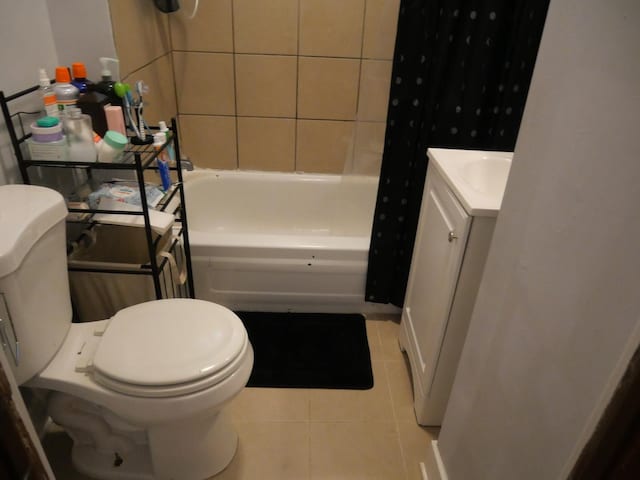 4417 S Campbell Ave, Chicago, IL 60632 - full bath with vanity, tile patterned floors, and shower / bath combination with curtain