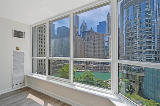405 N Wabash Ave Unit 506, Chicago, IL 60611 - unfurnished sunroom featuring a view of skyline and a water view