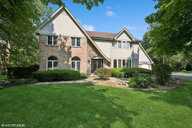 6579 Windham Ln, Long Grove, IL 60047 - tudor house featuring a front yard and brick siding