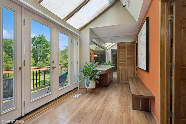 6579 Windham Ln, Long Grove, IL 60047 - doorway to outside featuring french doors, light wood-style floors, high vaulted ceiling, and plenty of natural light