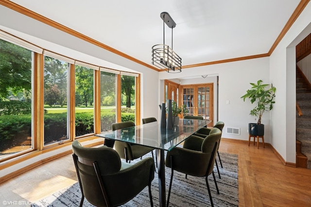 6579 Windham Ln, Long Grove, IL 60047 - dining room featuring healthy amount of natural light, stairway, ornamental molding, and light wood-style floors