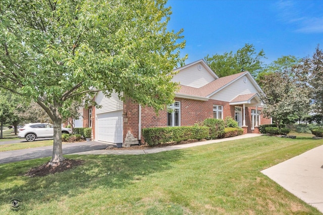 10754 Canterbury Dr, Mokena, IL 60448 - view of front of property featuring brick siding, asphalt driveway, a front lawn, roof with shingles, and a garage