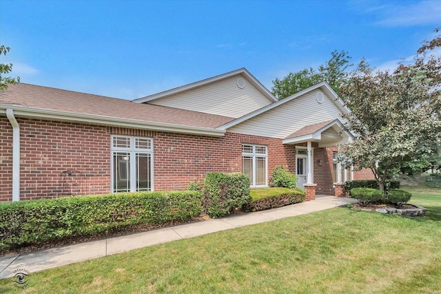 10754 Canterbury Dr, Mokena, IL 60448 - view of front of property featuring brick siding, a front yard, and a shingled roof