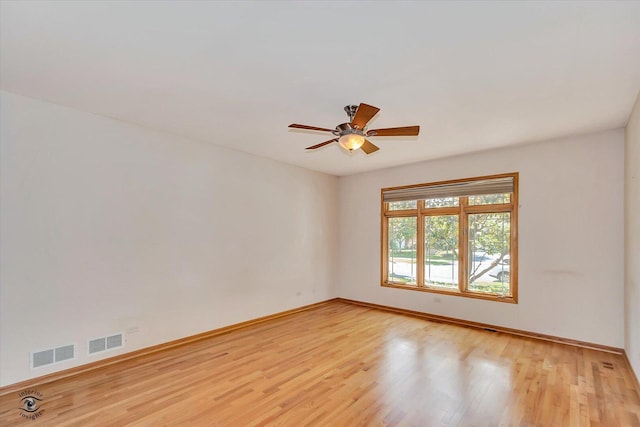 10754 Canterbury Dr, Mokena, IL 60448 - empty room with light wood finished floors and a ceiling fan